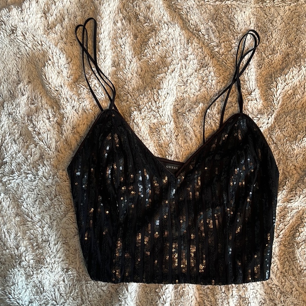 GUESS going out top